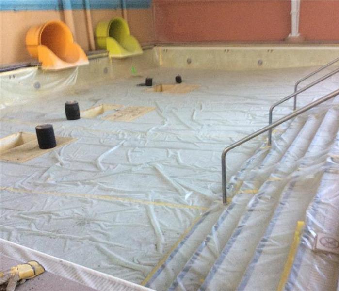 Plastic tarp in hotel pool 
