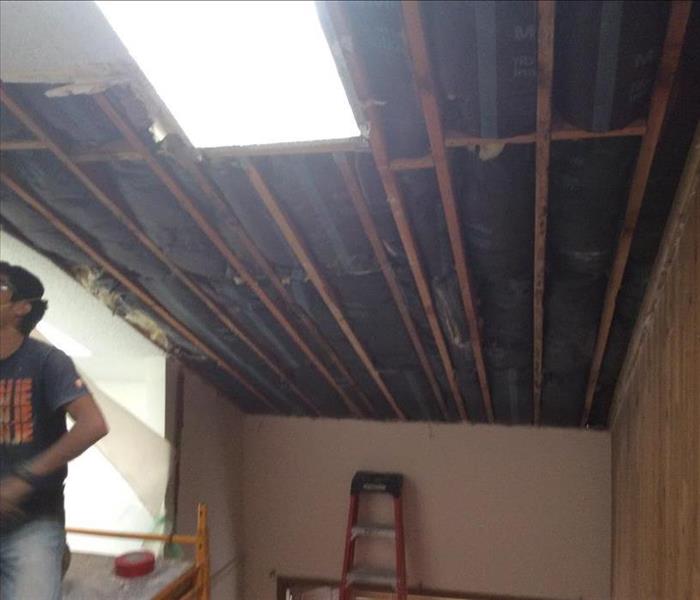 drywall ceiling removed , exposed joists
