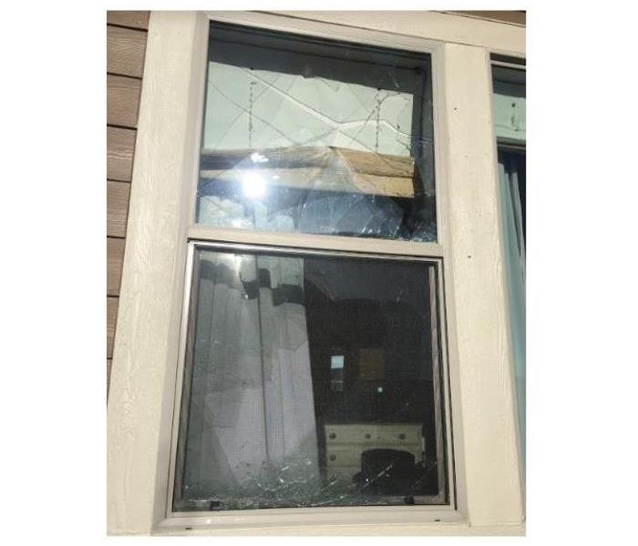 broken window in a home