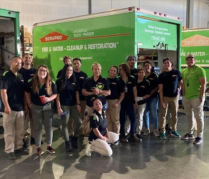SERVPRO Employees in front of green box truck